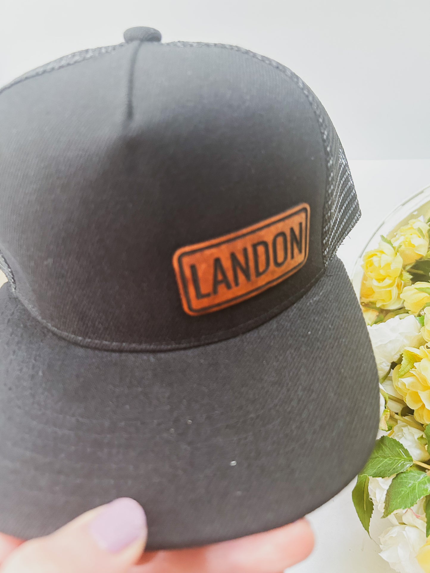 Personalized Leather Patch with Kids Name on Black Trucker Hat