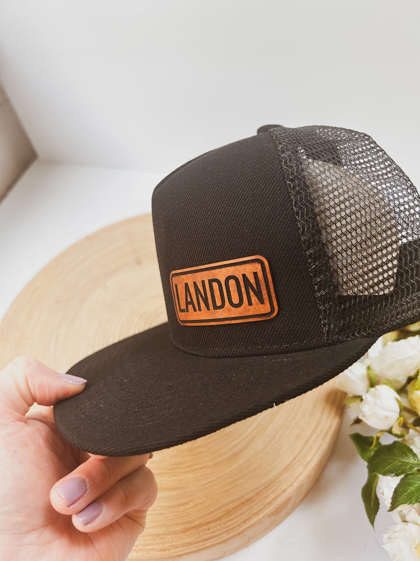 Personalized Leather Patch with Kids Name on Black Trucker Hat