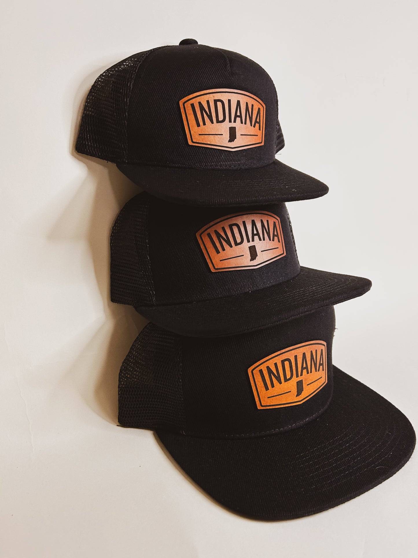 Rectangular Indiana Leather Patch on Black Trucker Hat