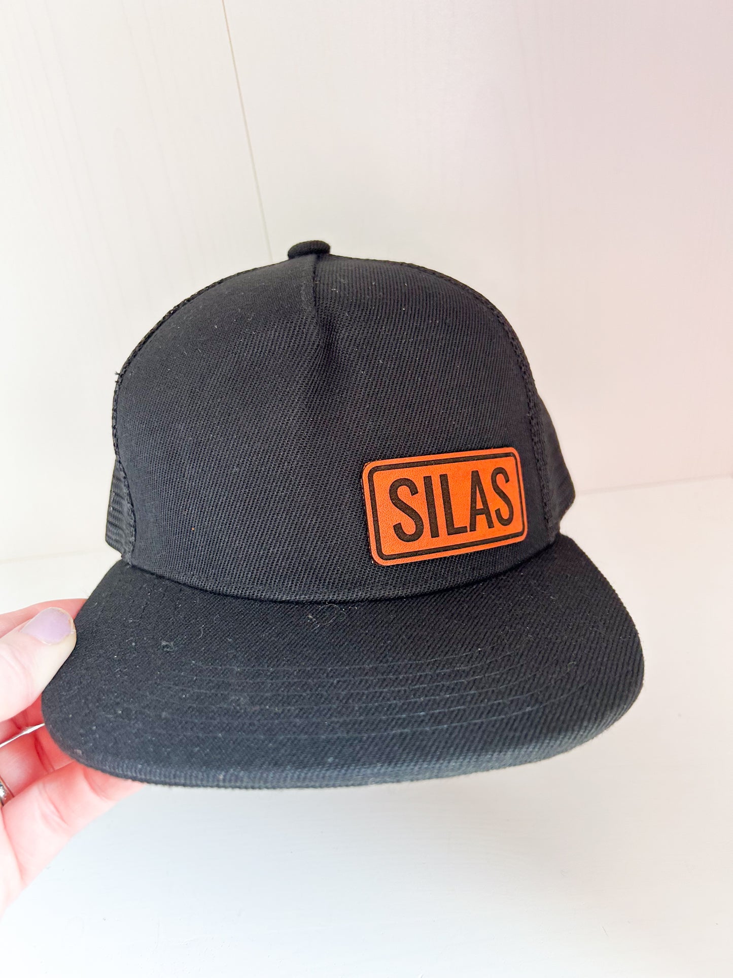 Personalized Leather Patch with Kids Name on Black Trucker Hat