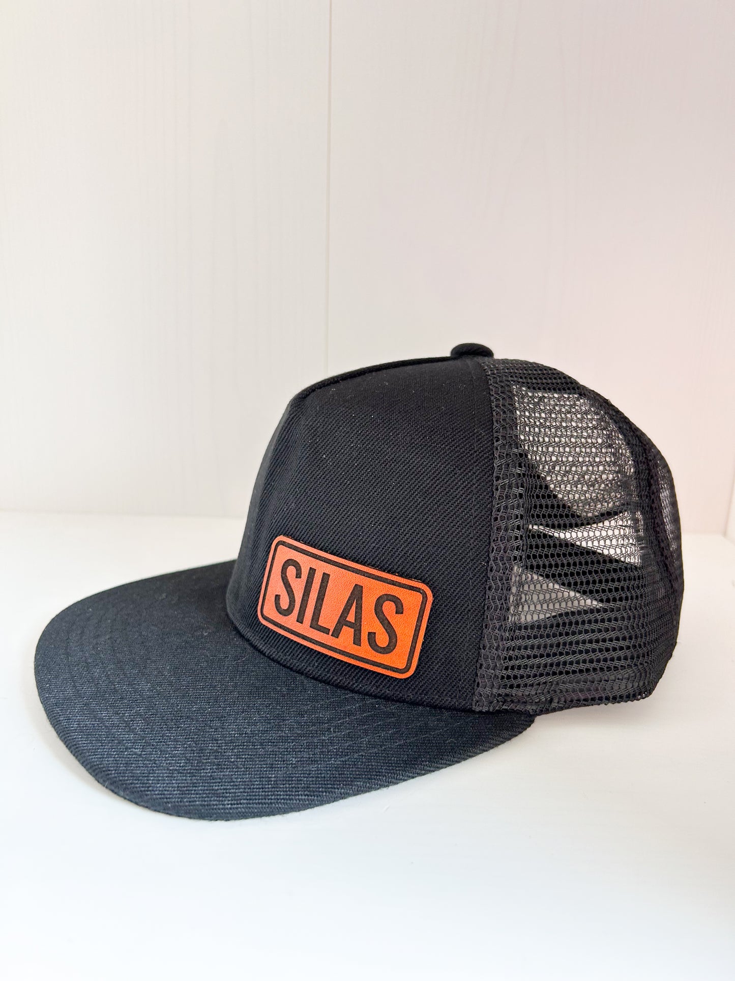 Personalized Leather Patch with Kids Name on Black Trucker Hat