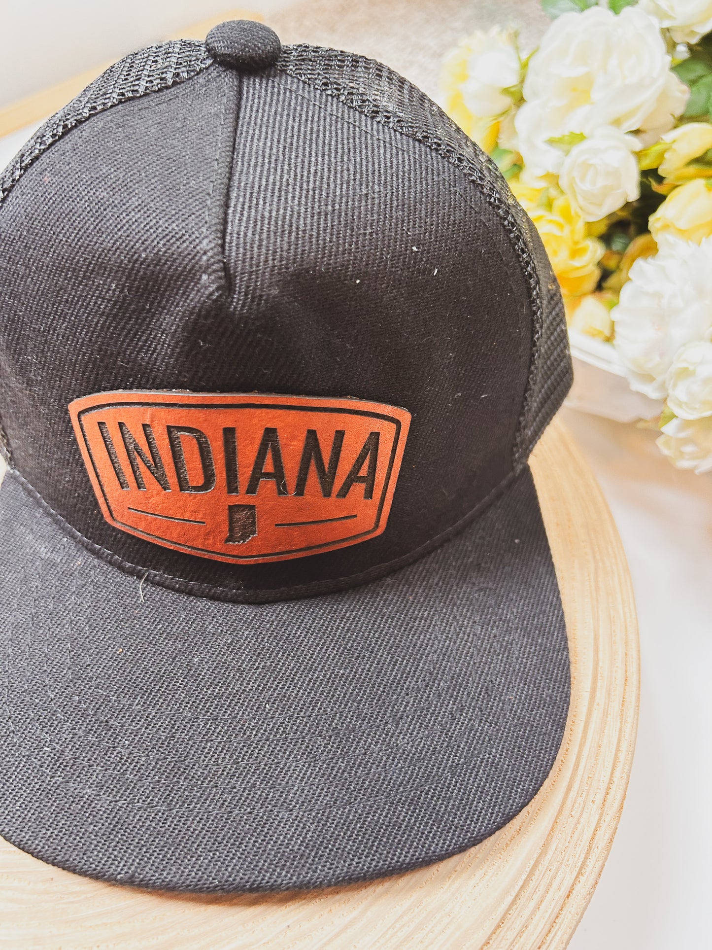 Rectangular Indiana Leather Patch on Black Trucker Hat
