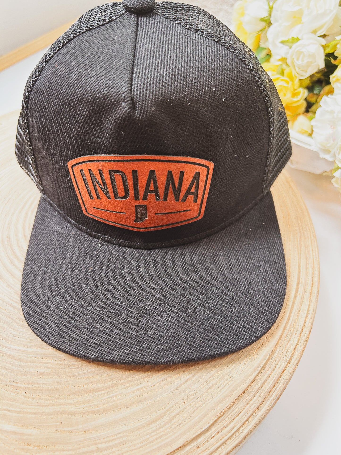 Rectangular Indiana Leather Patch on Black Trucker Hat
