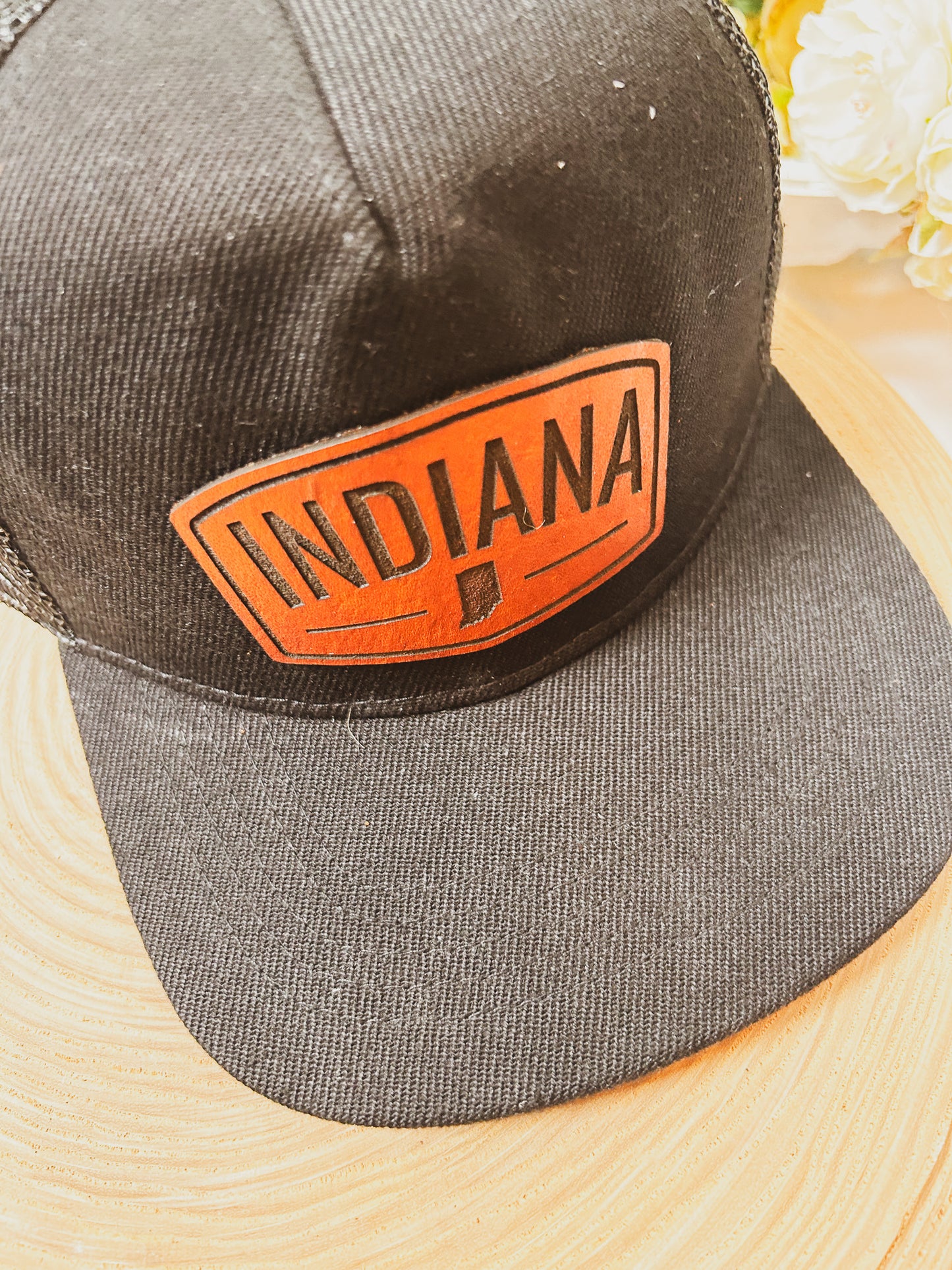Rectangular Indiana Leather Patch on Black Trucker Hat