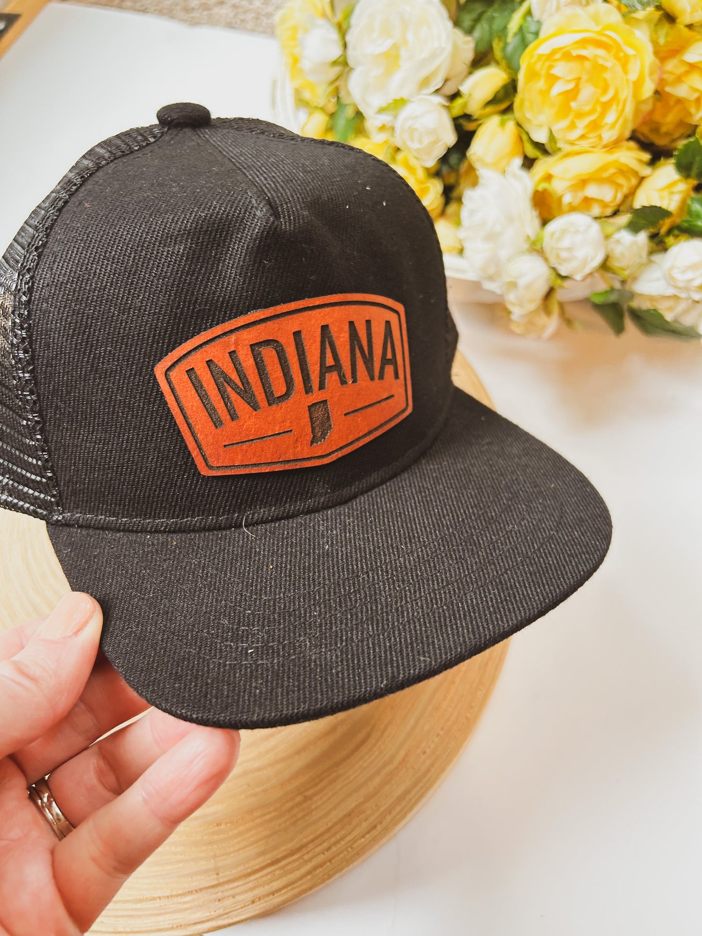 Rectangular Indiana Leather Patch on Black Trucker Hat