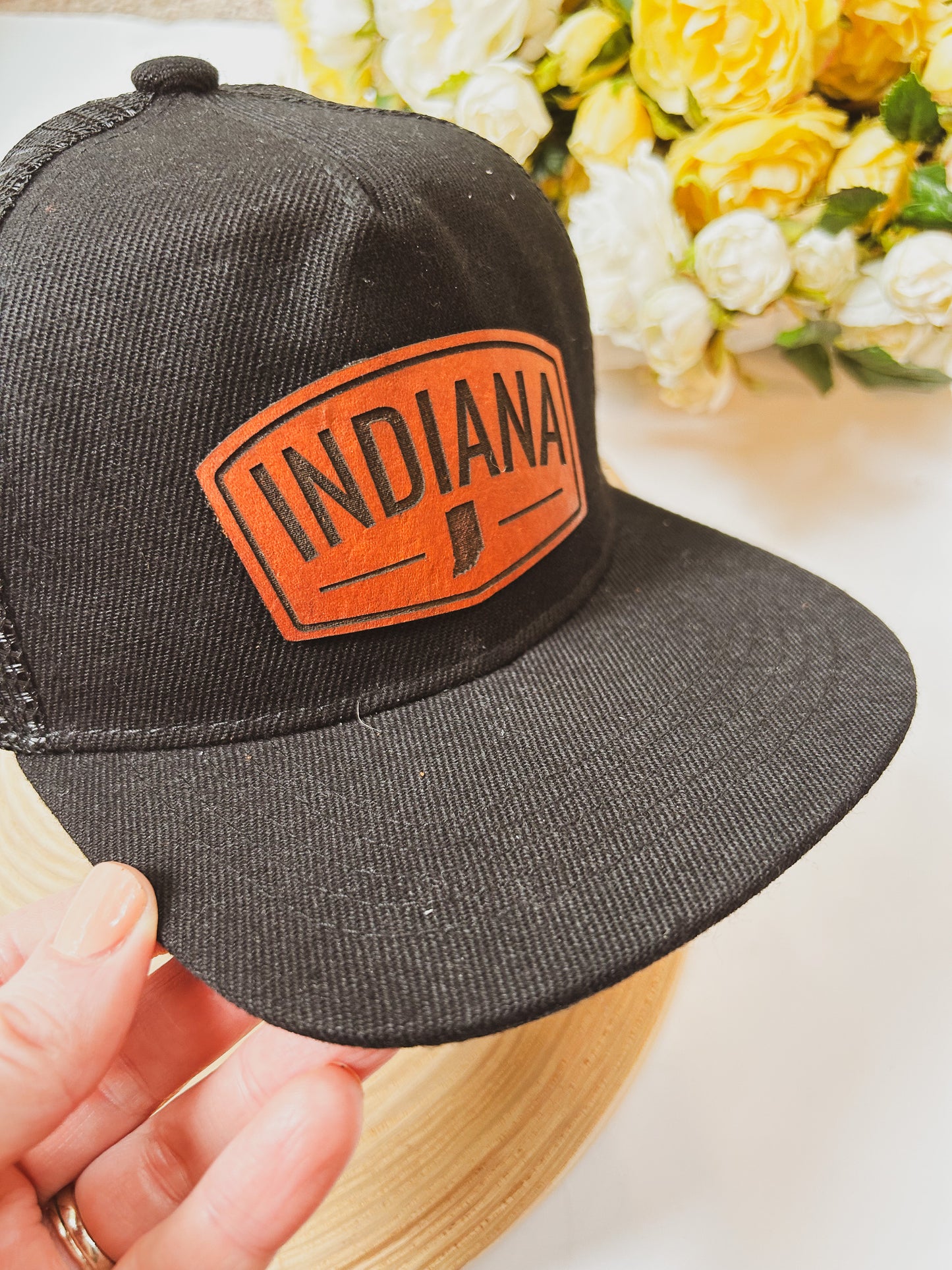 Rectangular Indiana Leather Patch on Black Trucker Hat