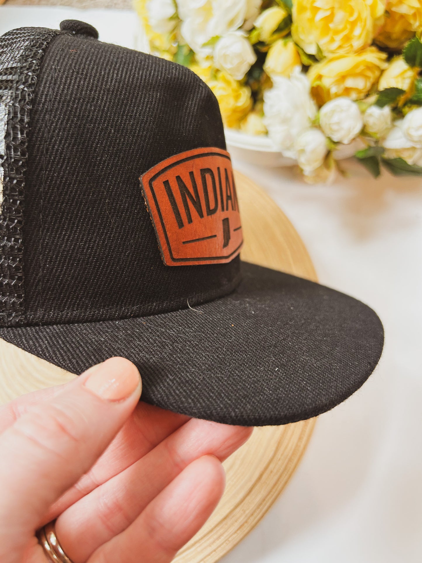 Rectangular Indiana Leather Patch on Black Trucker Hat