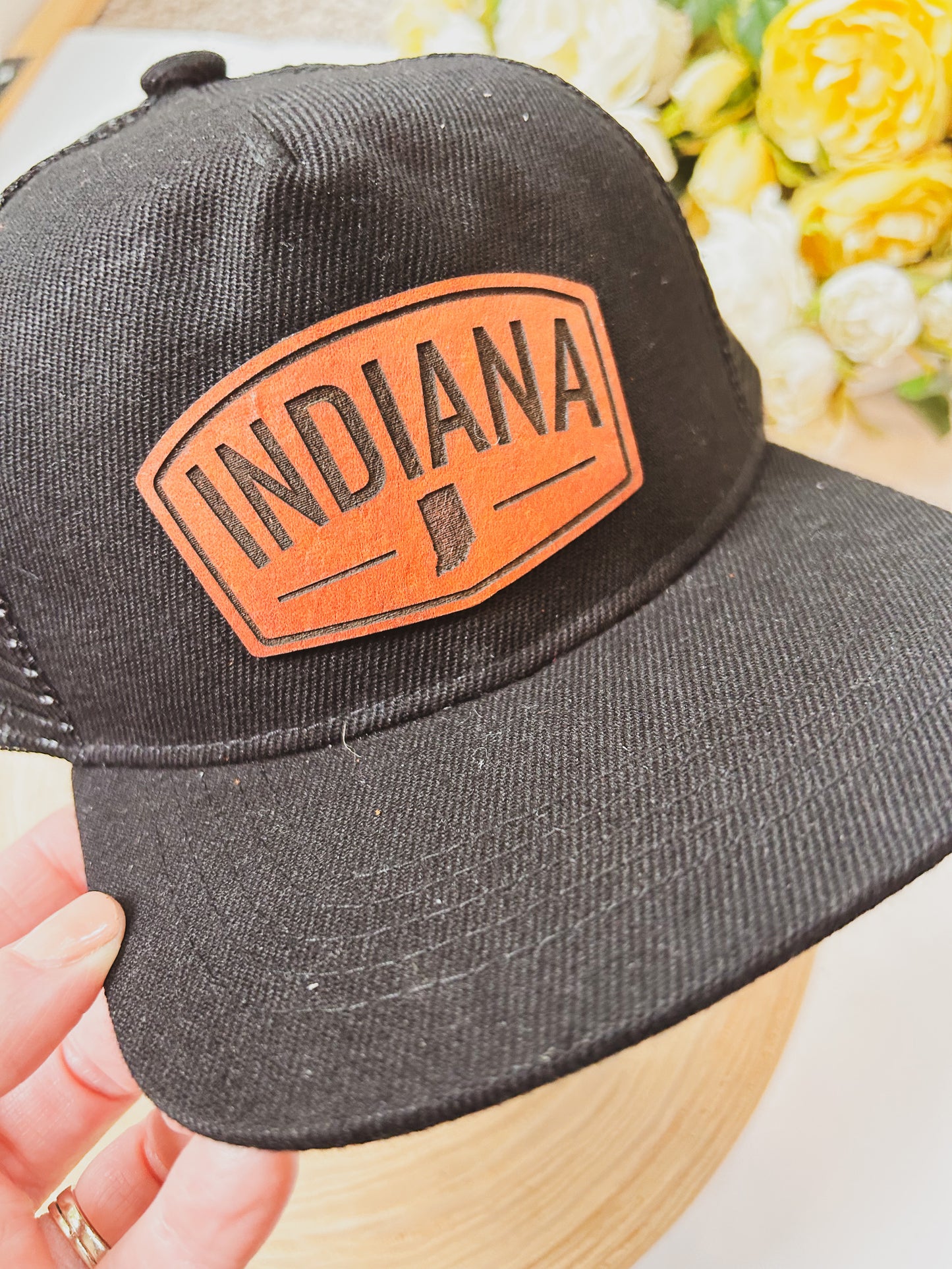 Rectangular Indiana Leather Patch on Black Trucker Hat