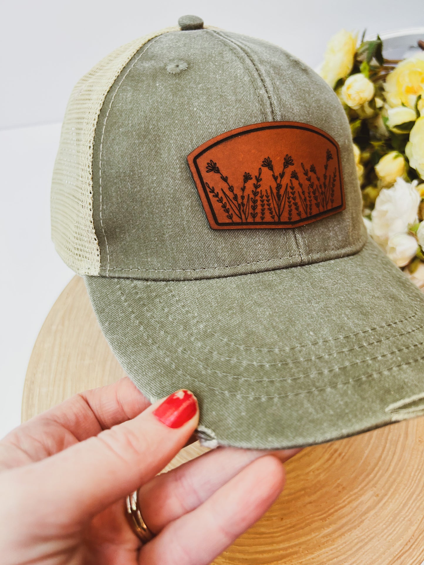 Wildflower Leather Patch on Distressed Olive Hat