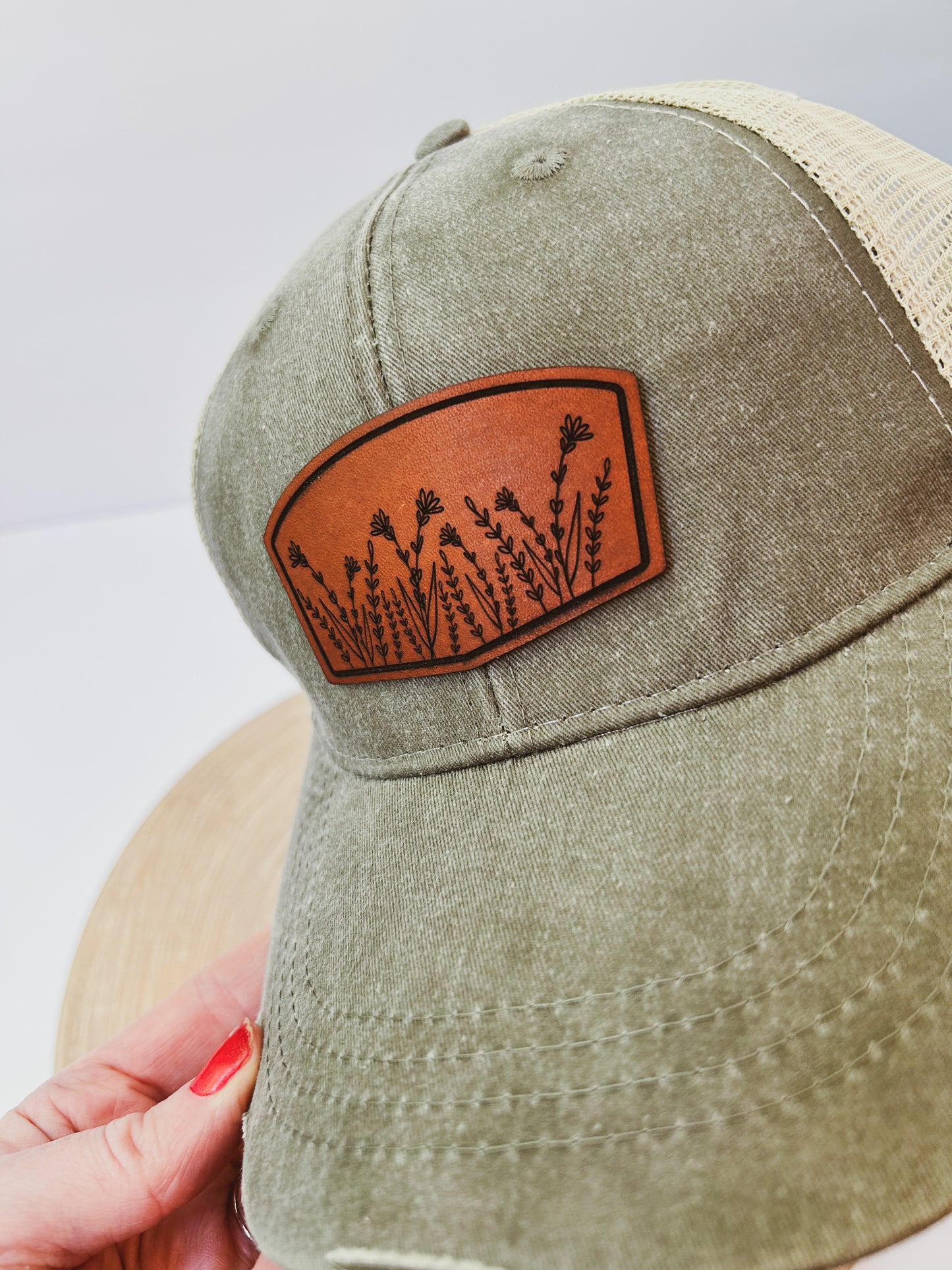 Wildflower Leather Patch on Distressed Olive Hat