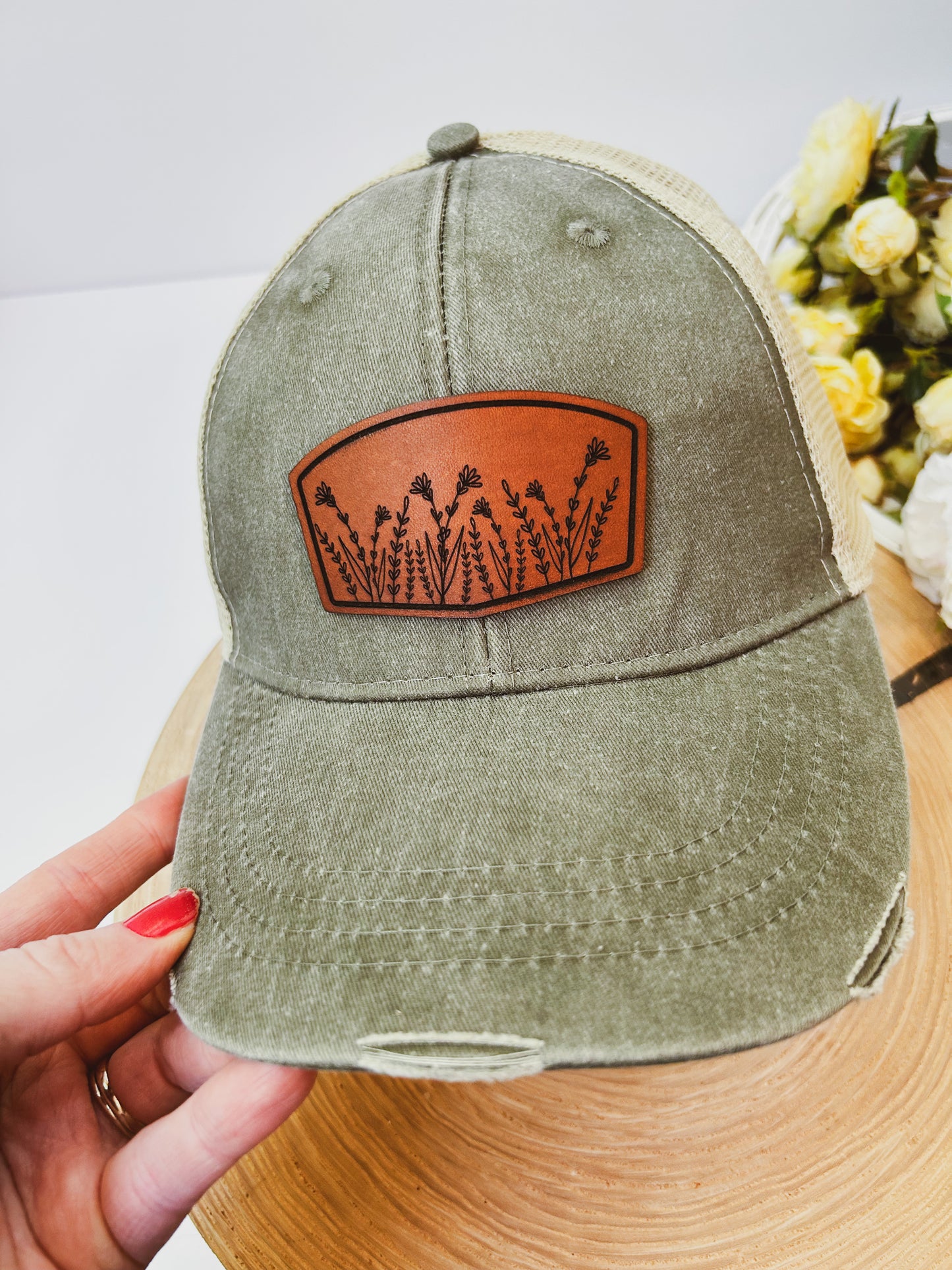 Wildflower Leather Patch on Distressed Olive Hat