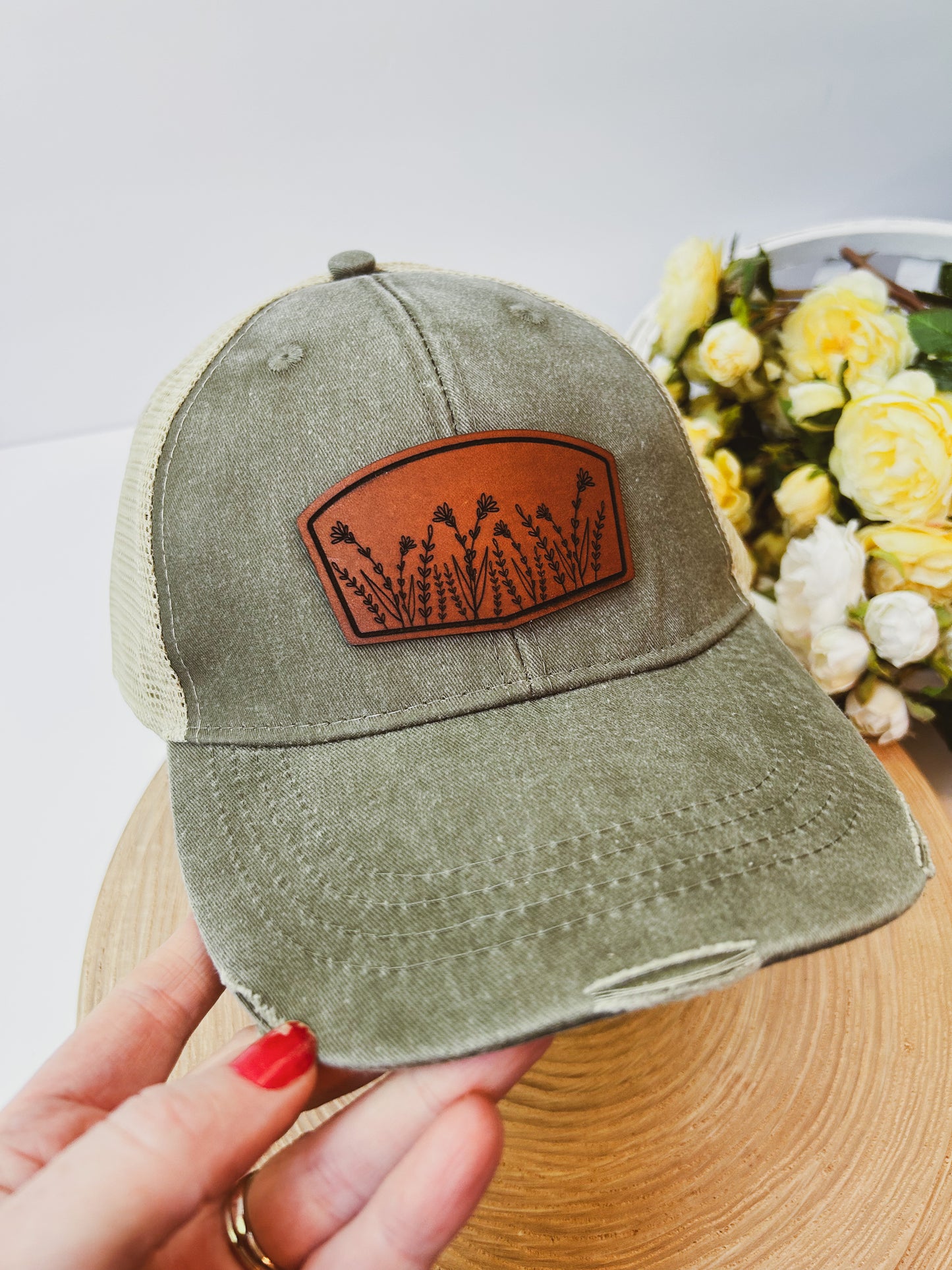 Wildflower Leather Patch on Distressed Olive Hat
