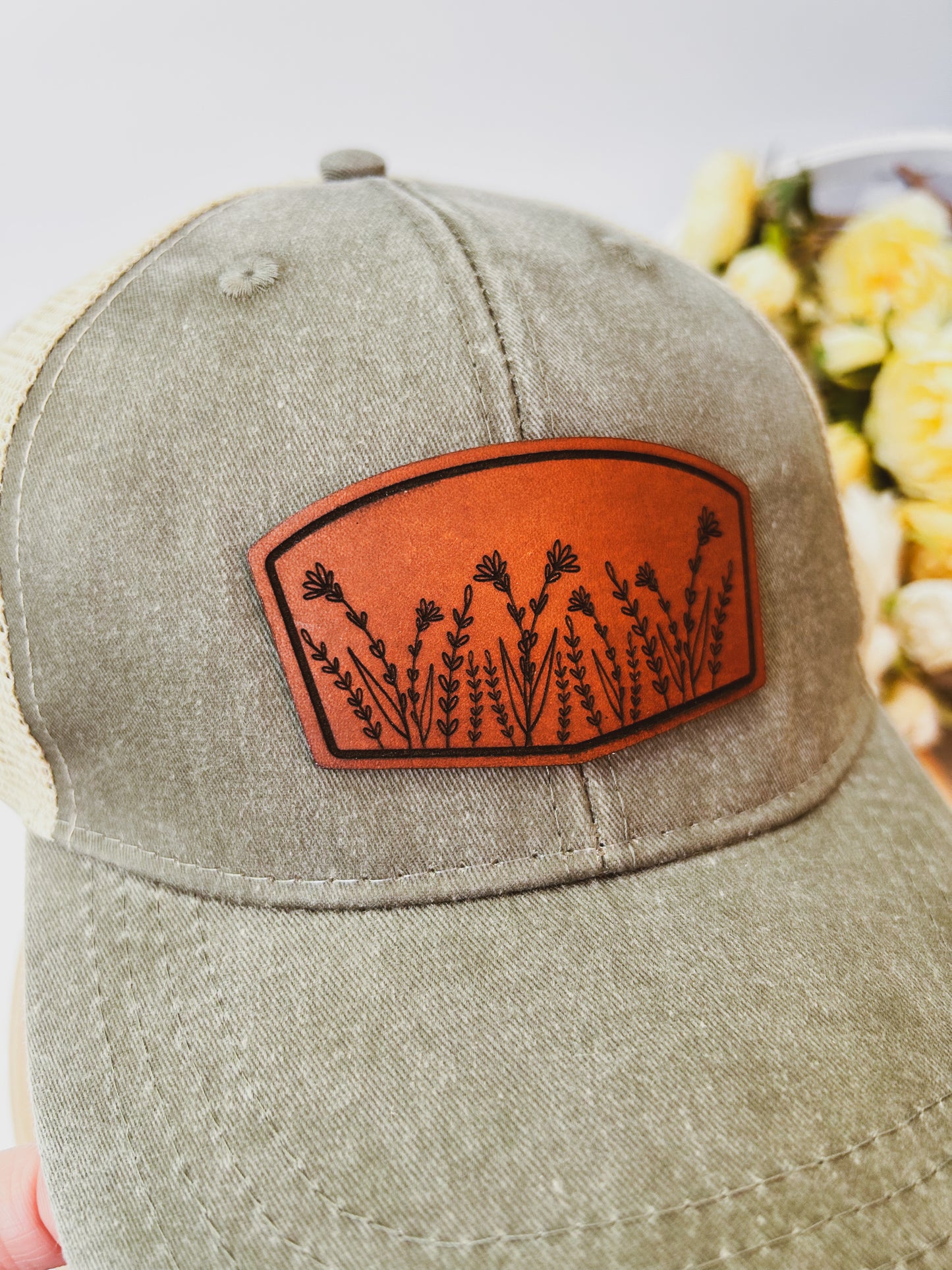 Wildflower Leather Patch on Distressed Olive Hat