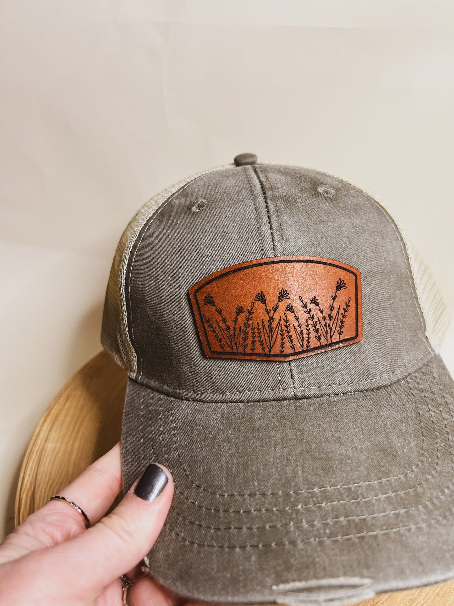 Wildflower Leather Patch on Distressed Olive Hat