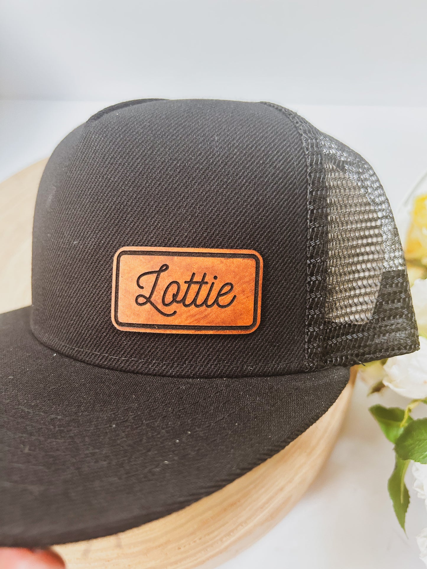 Personalized Leather Patch with Kids Name on Black Trucker Hat