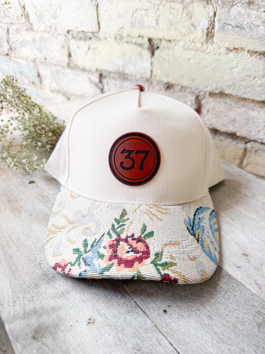 Custom Logo Hat on Cream Hat with Floral Bill