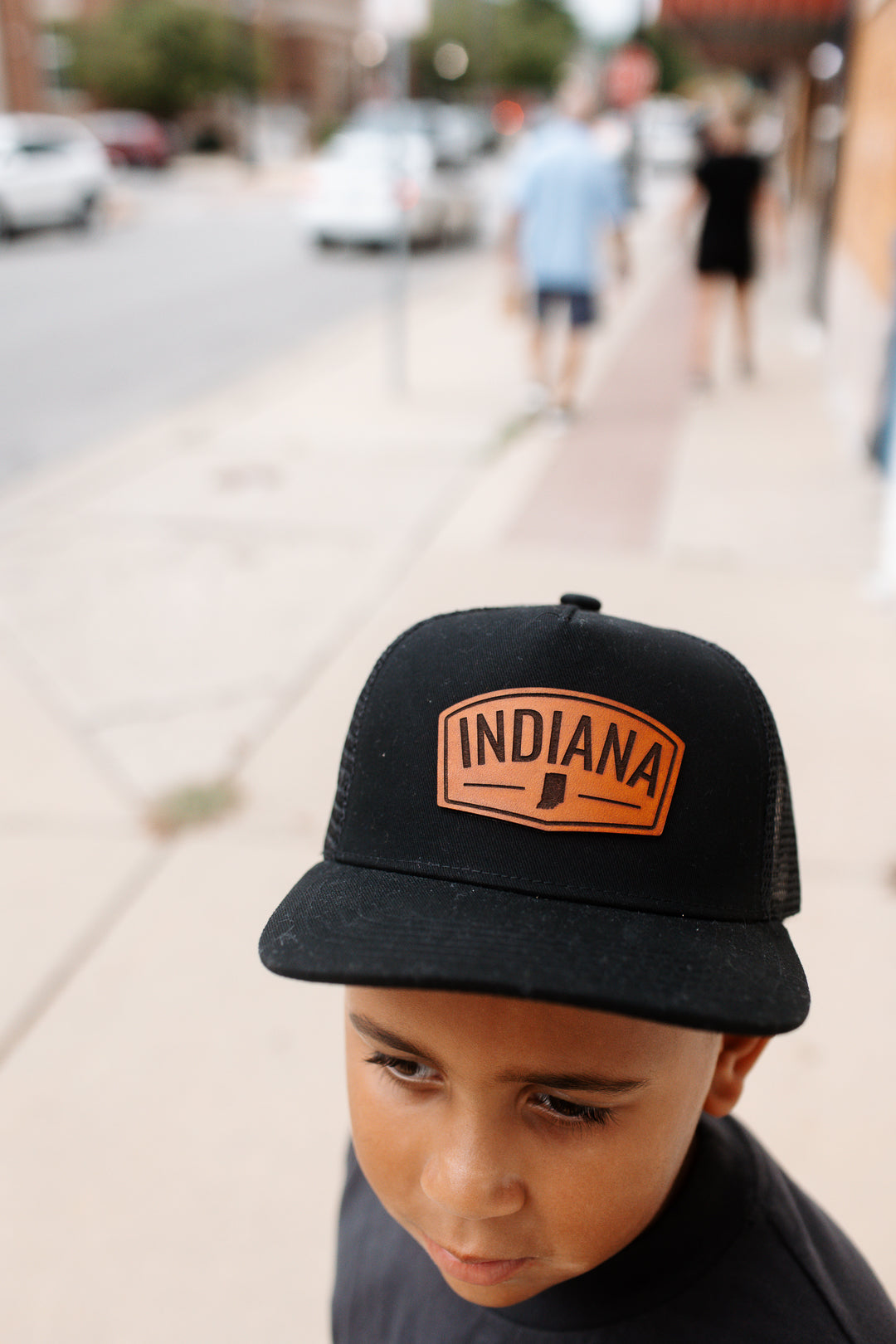 Indiana Arch Leather Patch on Black Trucker Hat