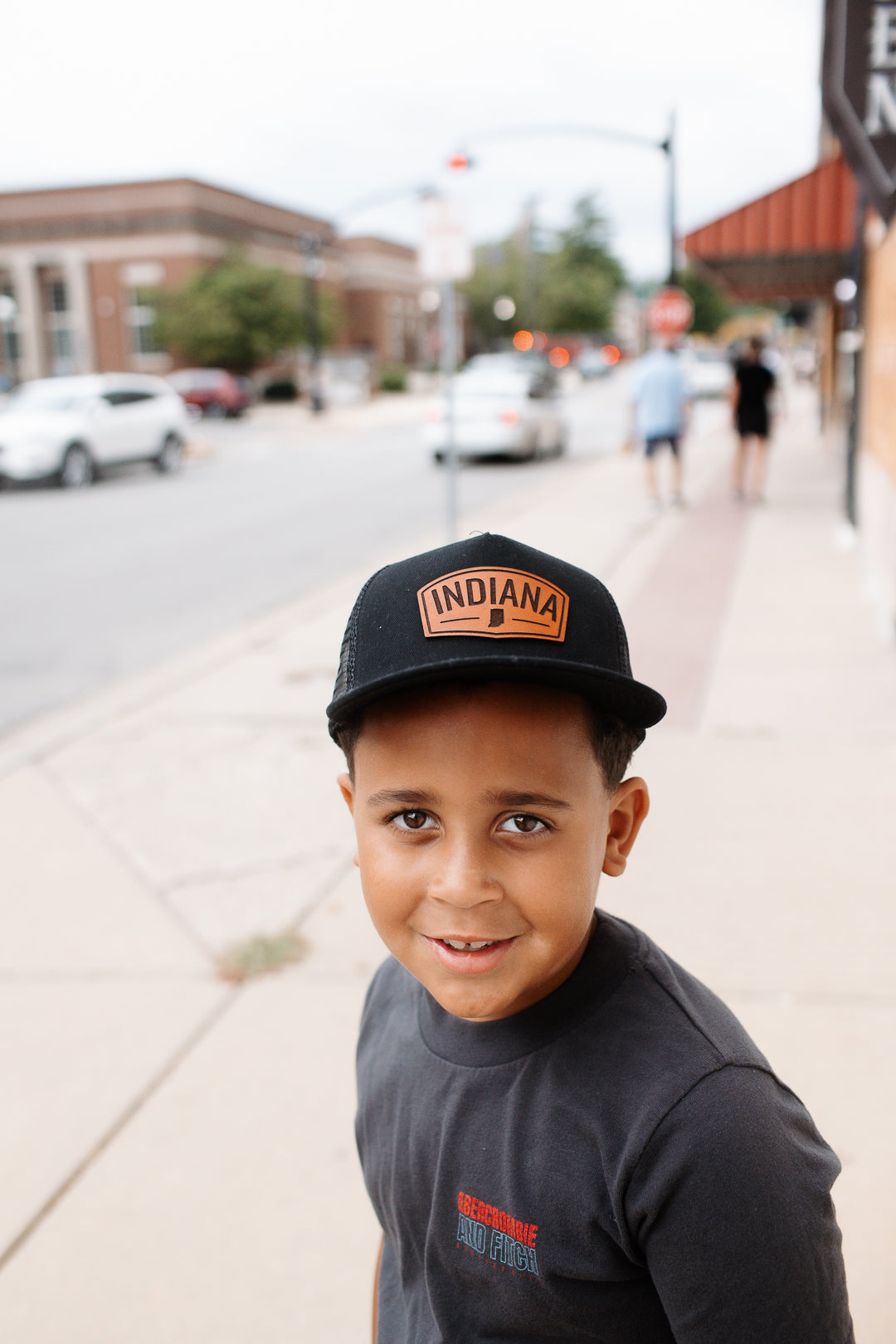 Indiana Arch Leather Patch on Black Trucker Hat