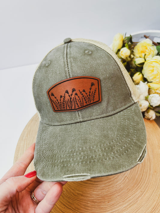 Wildflower Leather Patch on Distressed Olive Hat